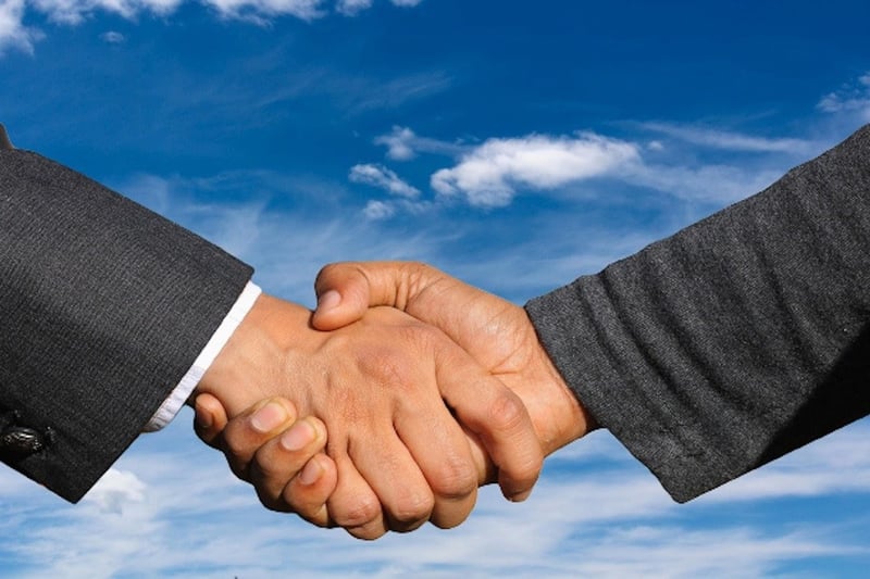 image of two men shaking hands