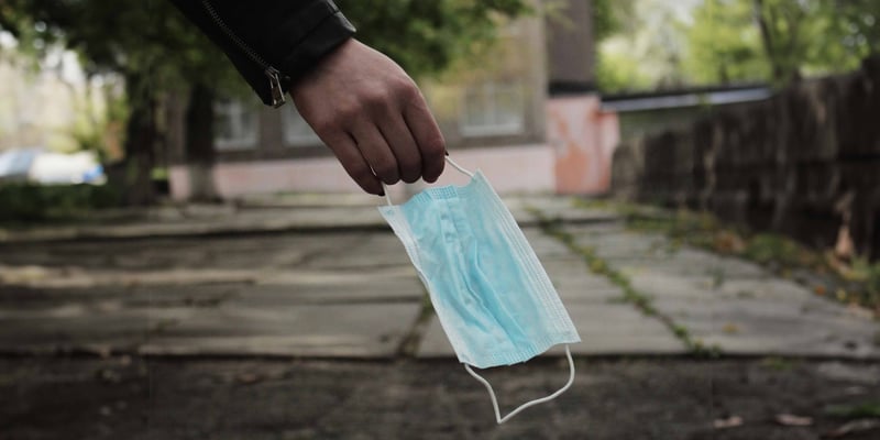 hand holding a medical mask 