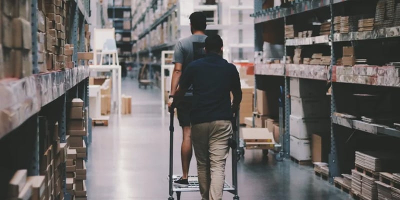 two men in warehouse